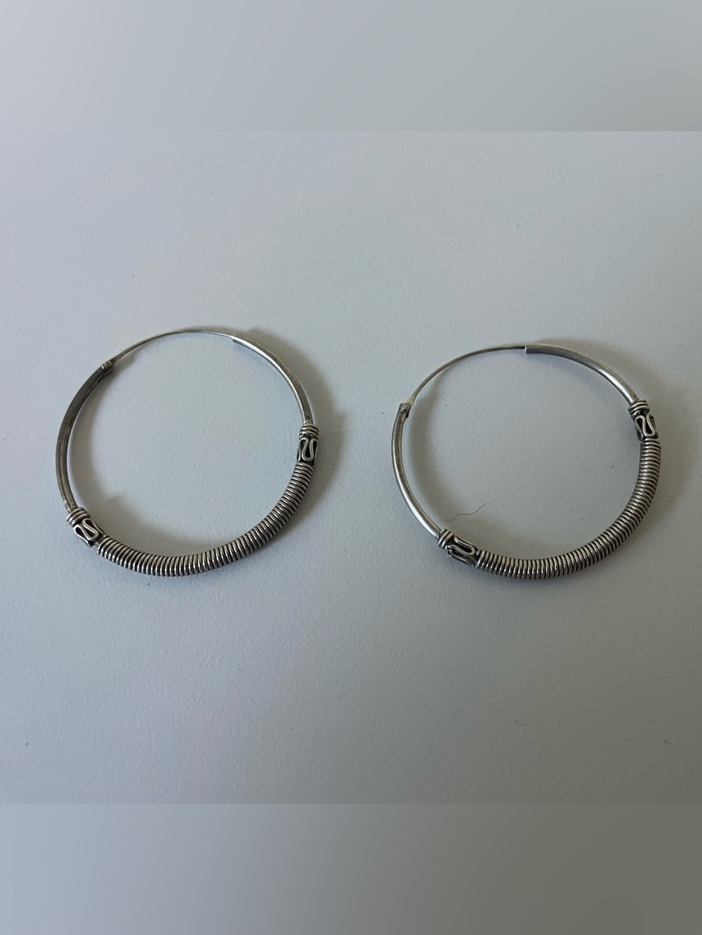 Sterling silver Bali-style hoop earrings